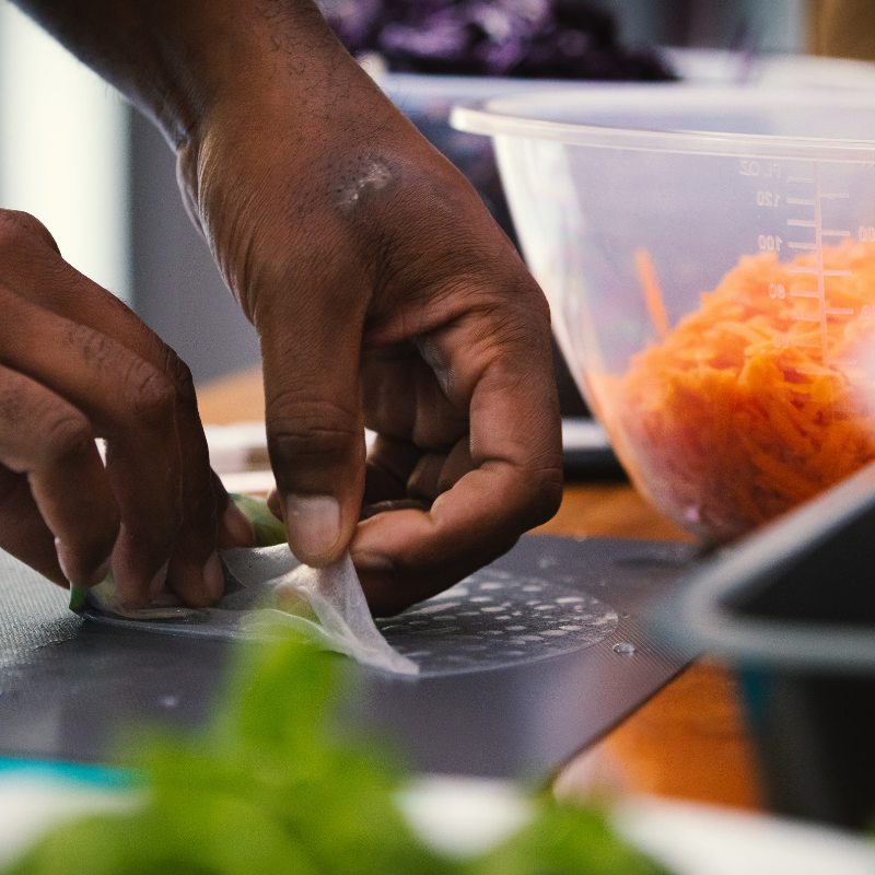 Hands chopping fresh vegetables