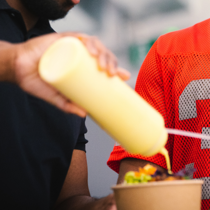 Squeezing sauce onto food — care in preparation